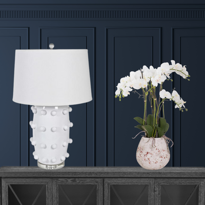 White bobble lamp with orchid